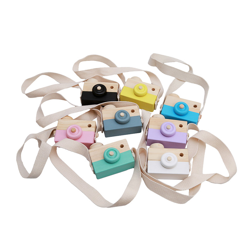 Set of colorful toy cameras with straps on a white background