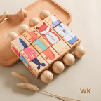 Wooden Rainbow Rattle lying on a soft play mat with other sensory toys