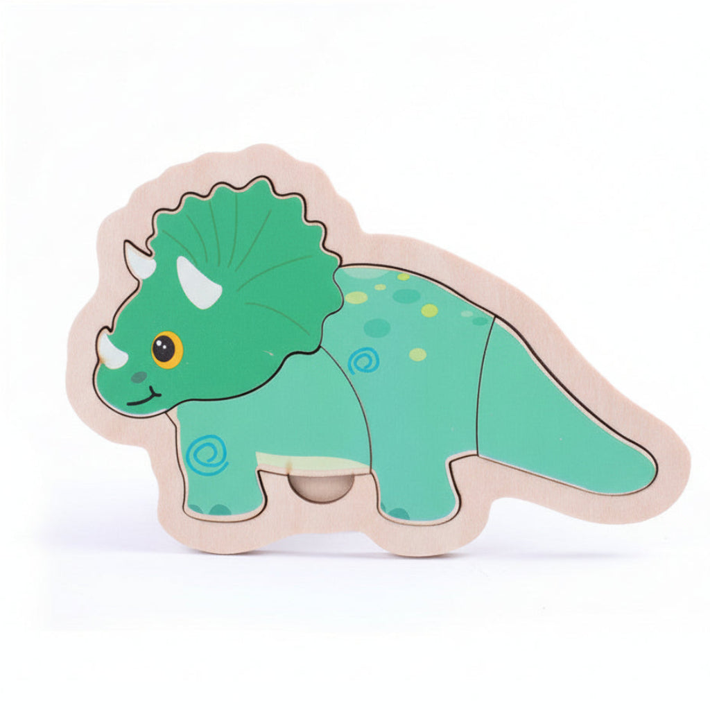 Green dinosaur-shaped wooden puzzle on a white background