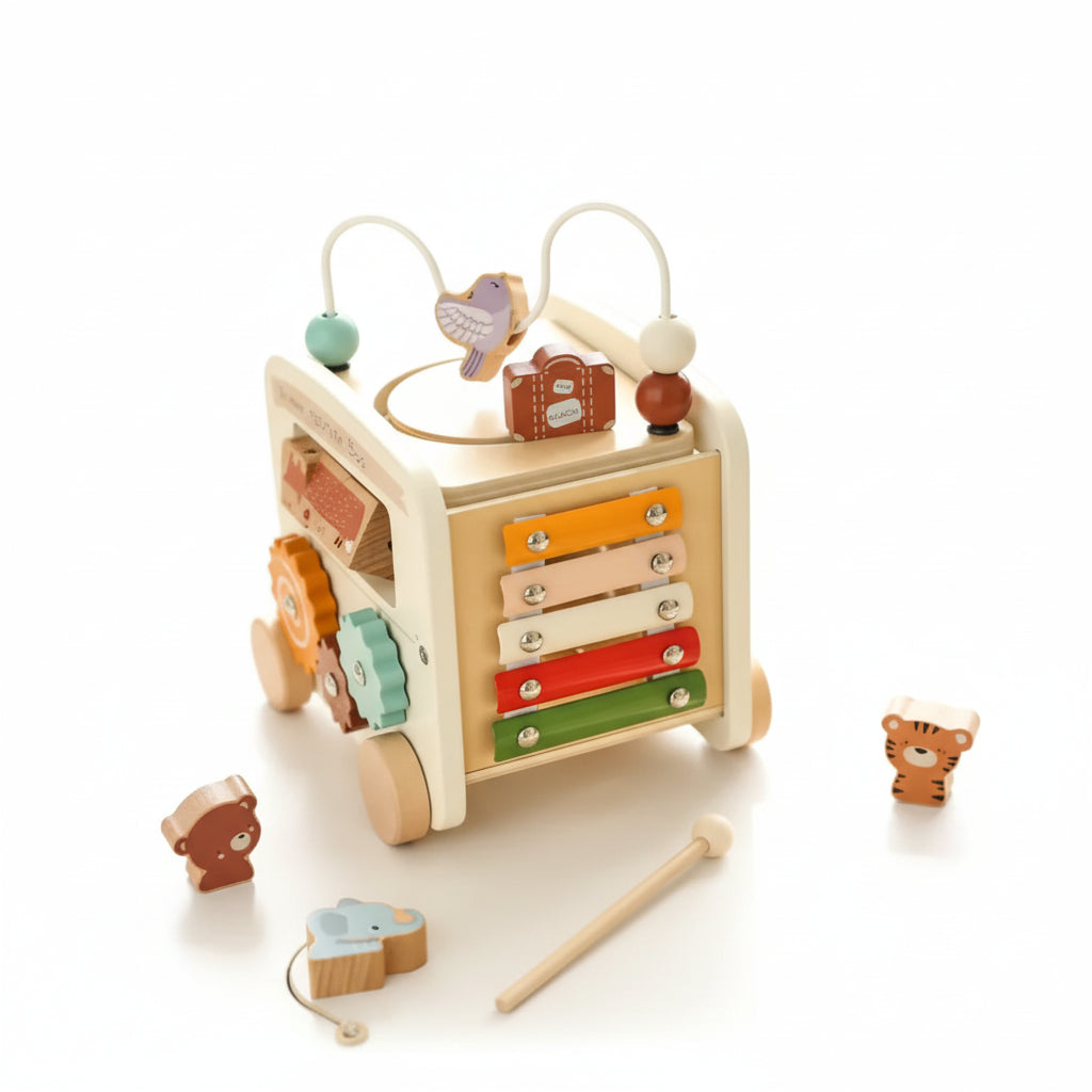 Wooden toy with multiple levels and colorful components on a light surface.