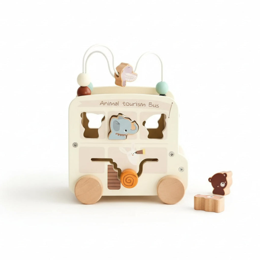 Wooden toy bus with animal shapes on a white background