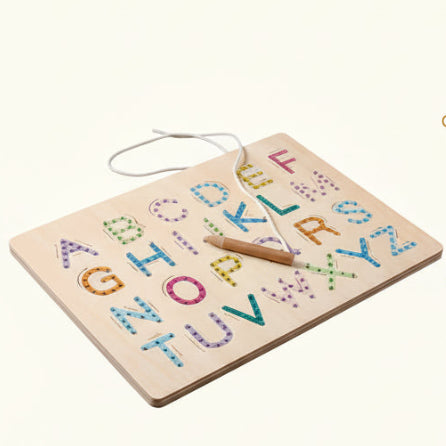 Wooden alphabet puzzle with colorful letters on a blue background