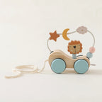 Wooden toy with a lion figure and colorful beads on a white background