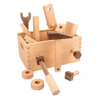 Wooden toy toolbox with tools on a white background