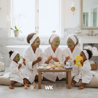Family of five in a bathroom with green face masks, white robes, and a 'WK' logo.