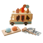 Wooden toy truck with shape sorter, hammer, and money on a white background