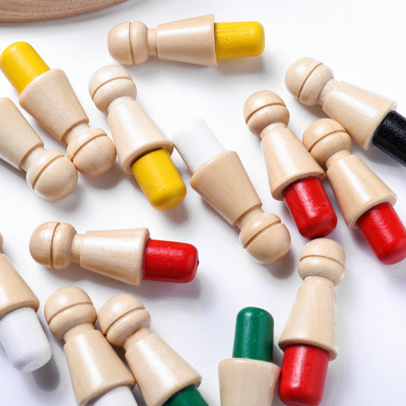 Colorful wooden chess pieces on a white surface