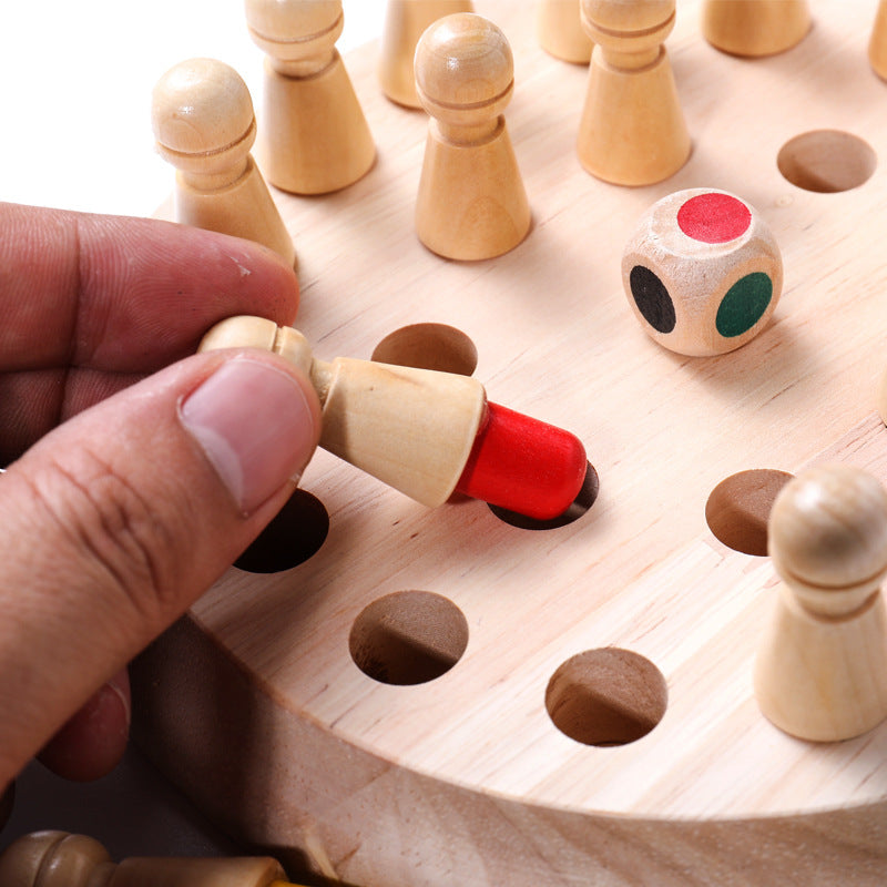 Hand interacting with a wooden puzzle piece on a board with other pieces and a dice.