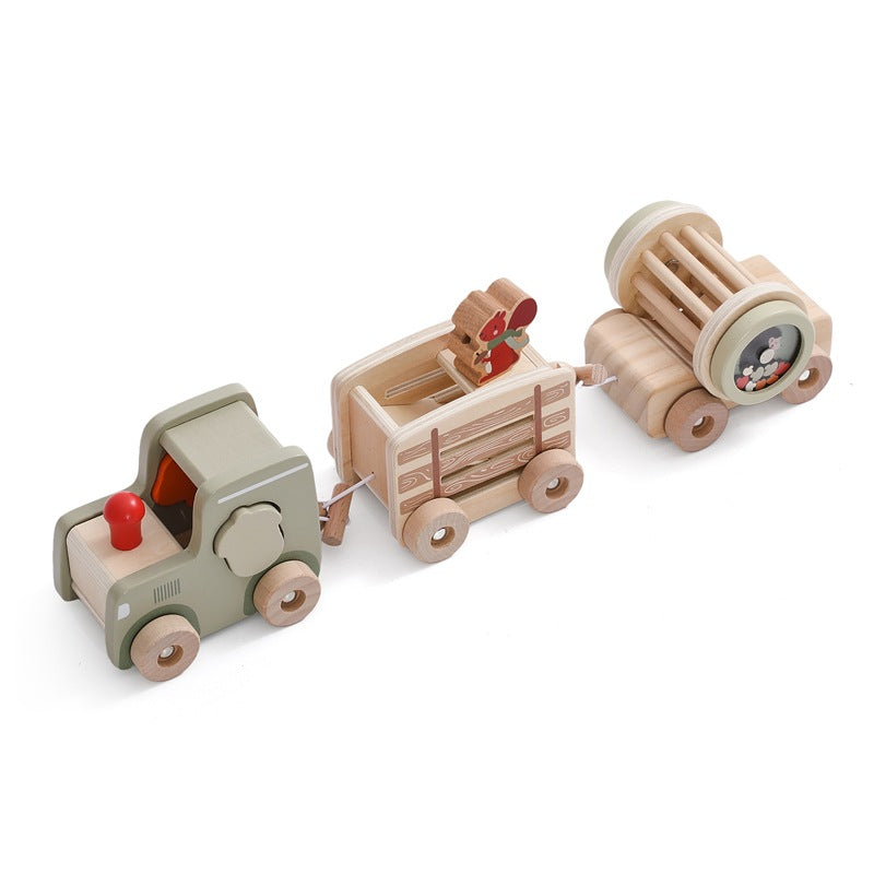 Child playing with a multi-functional wooden train for shape recognition and stacking, an educational and sustainable toy.

