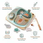 Wooden toy set with various shapes and a fishing rod on a carpeted floor.