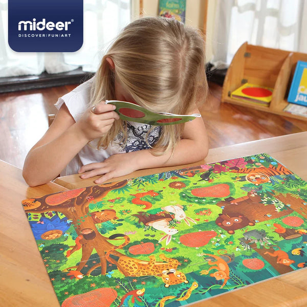 Child playing with a colorful puzzle mat featuring animals, with 'mideer' branding visible.