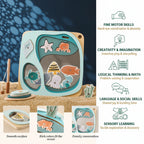 Toy fishing game with ocean-themed figures on a sand and blue background