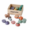 wooden food cutting sets with various kitchen tools and pretend food items like meat, fish, and vegetables.